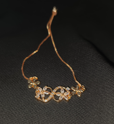 Blossom Curve Bracelet – Crystal-studded floral bracelet with adjustable chain
