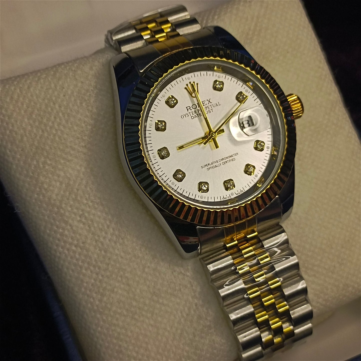 Two tone watch gold and silver view at an angle on a foam in a box