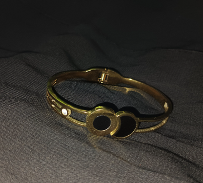 Noir Orbit Cuff – Twin circle gold bangle