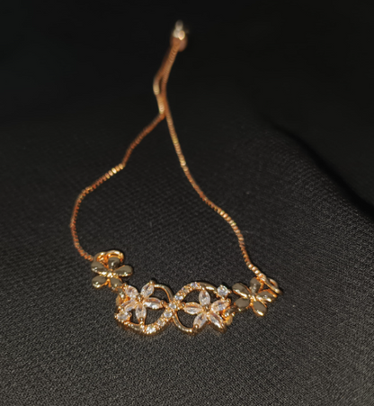 Blossom Curve Bracelet – Crystal-studded floral bracelet with adjustable chain