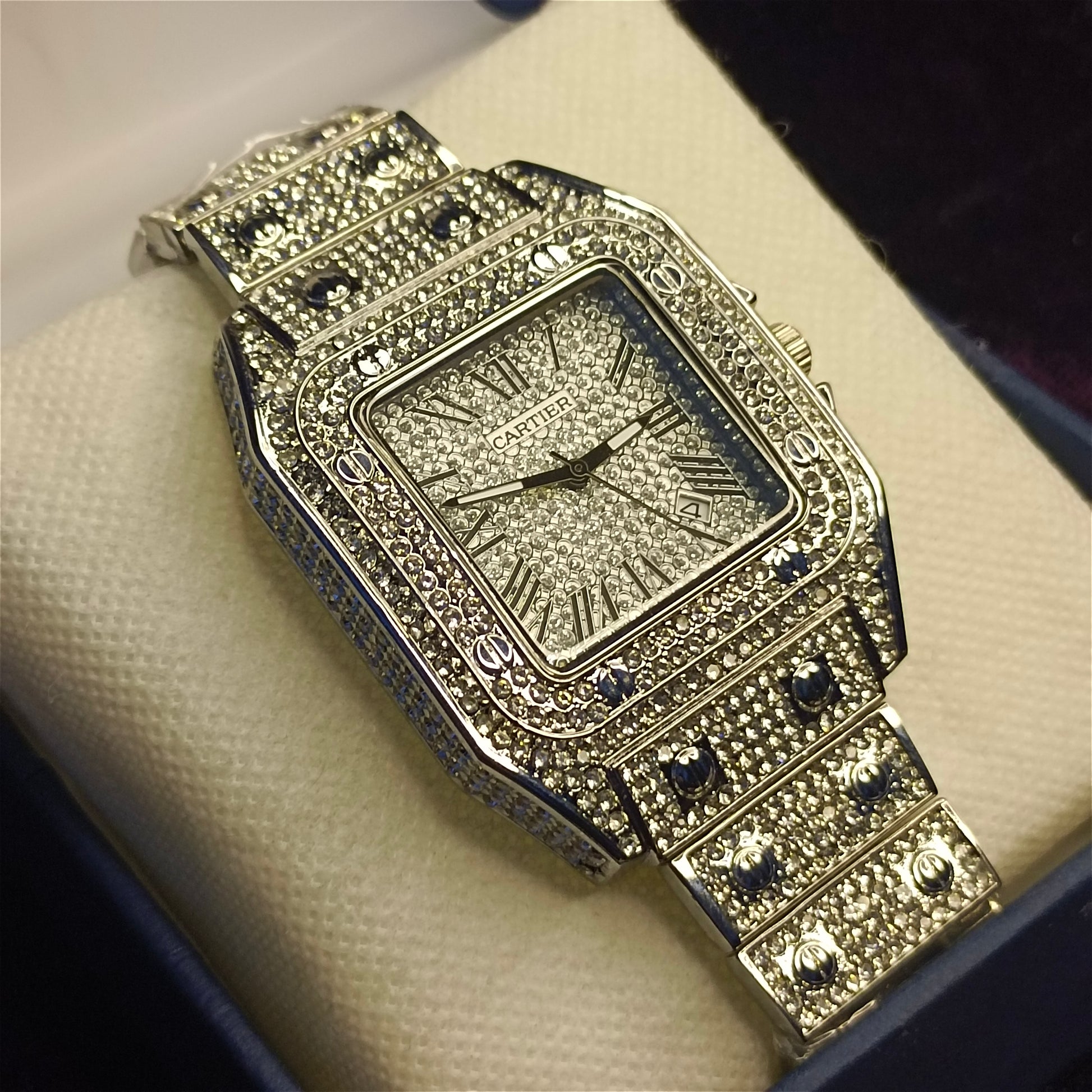 Rhinestone watch on foam in a blue box
