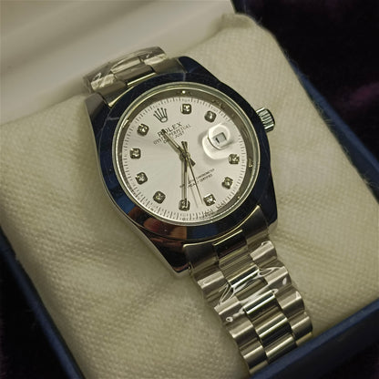 Silver watch with a white face on a white foam in a blue box