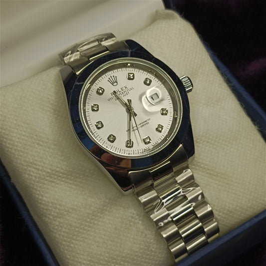 Silver watch with a white face on a white foam in a blue box